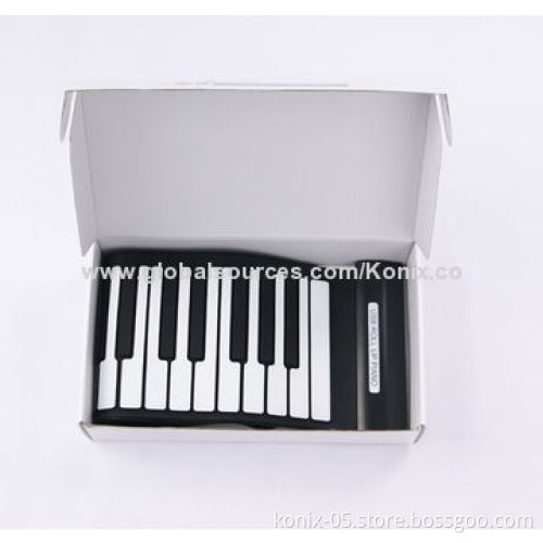 Some one play a folding roll up piano for learning